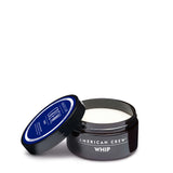 American Crew Whip Lightweight Styling Cream — 85 g tub with the lid resting beside it, showing the white whipped formula