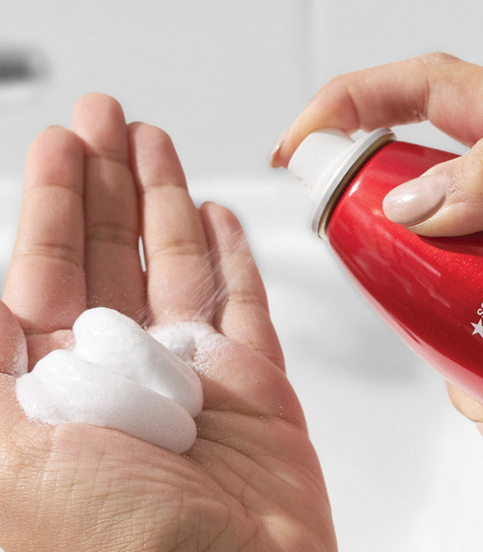SexyHair Big Root Pump Volumizing Spray Mousse — mousse being dispensed from the can into a hand