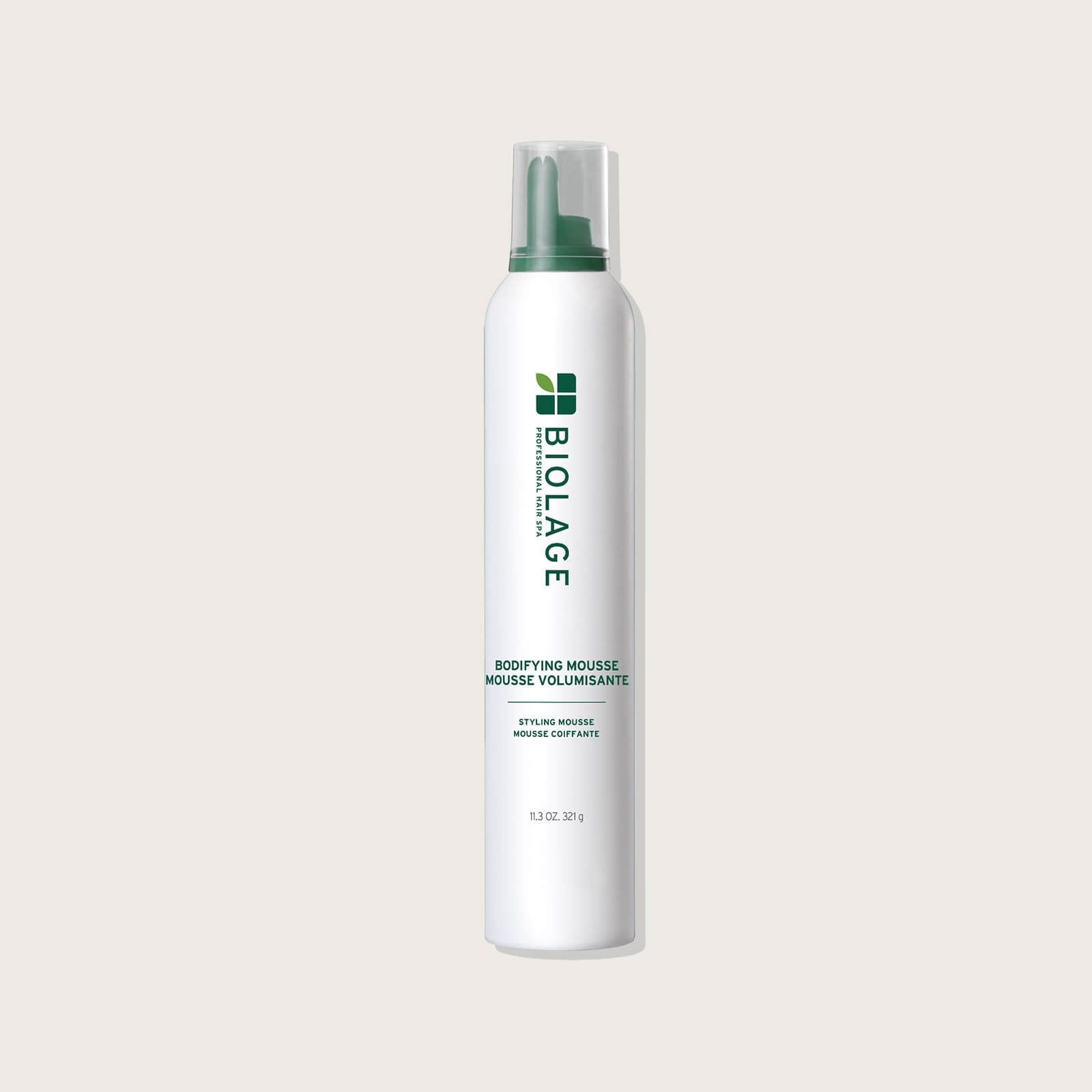 Biolage Bodifying Mousse 329 g — aerosol can on a warm neutral background