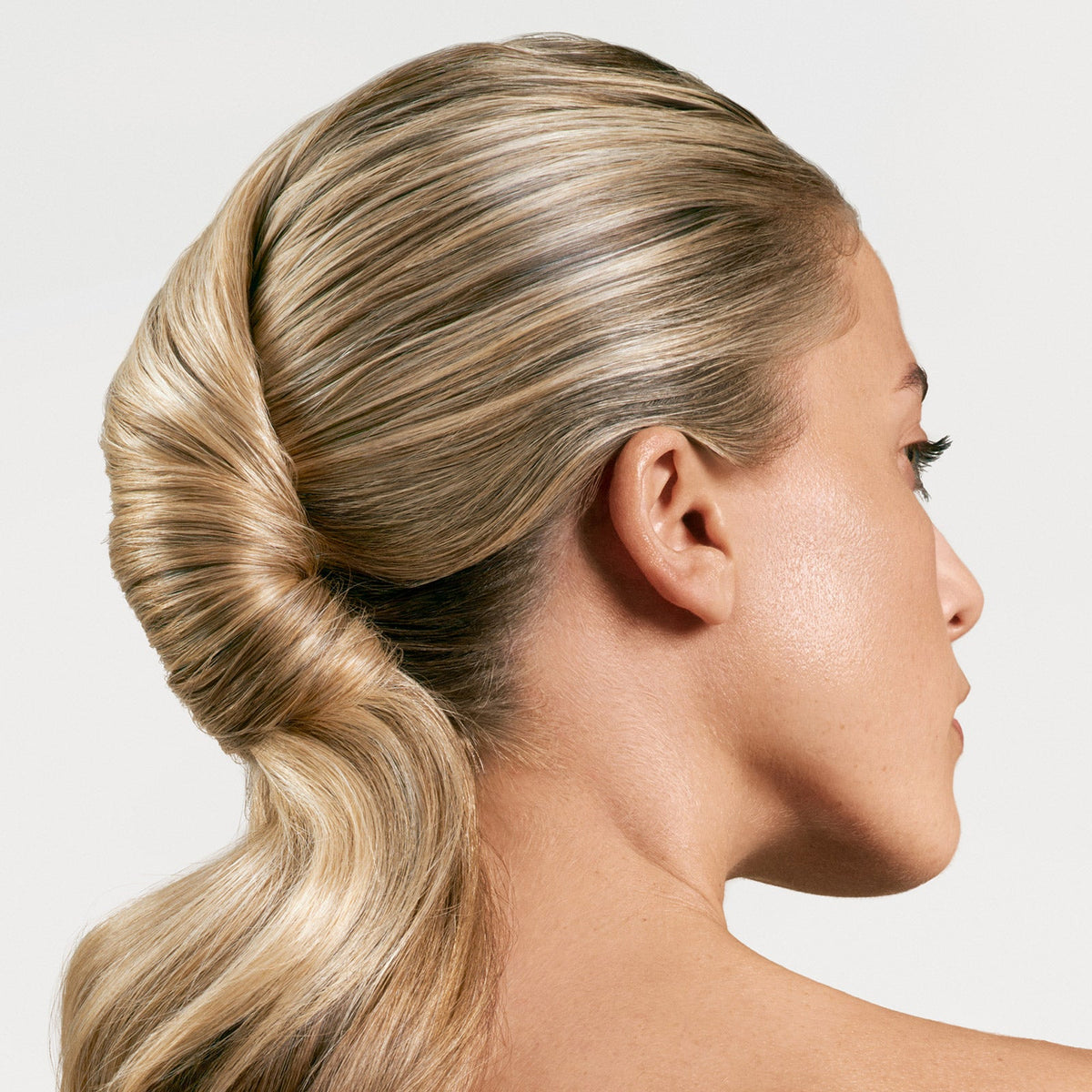 Biolage Finishing Spritz — sleek low chignon finished and held in place