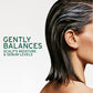 Biolage Scalp Sync Oil Balancing Serum — benefit card: gently balances the scalp's moisture and sebum levels, model with sleek dark hair