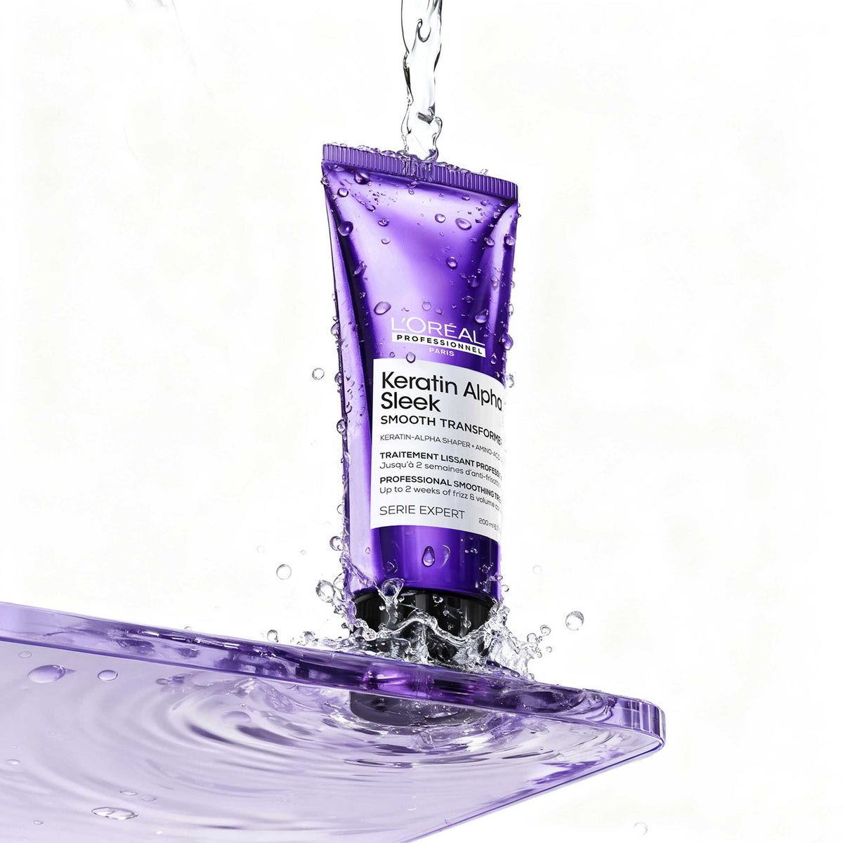 L'Oréal Professionnel Keratin Alpha Sleek Smooth Transformer — tube under running water
