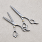 Otto 6-inch Haircutting & Thinning Shear Set — both shears laid out together on a light stone salon surface