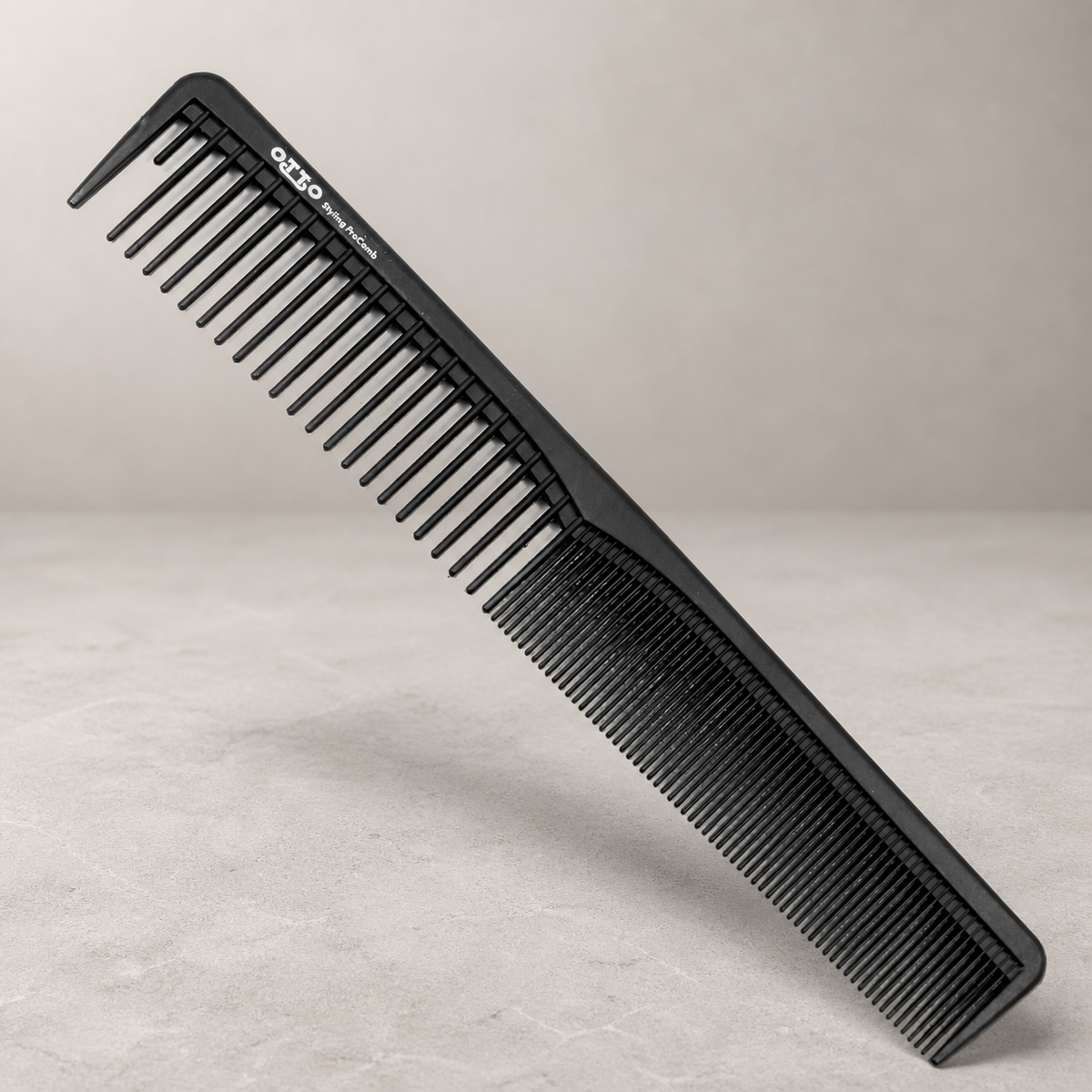 Otto 7-inch dual-tooth styling comb on a light stone salon surface