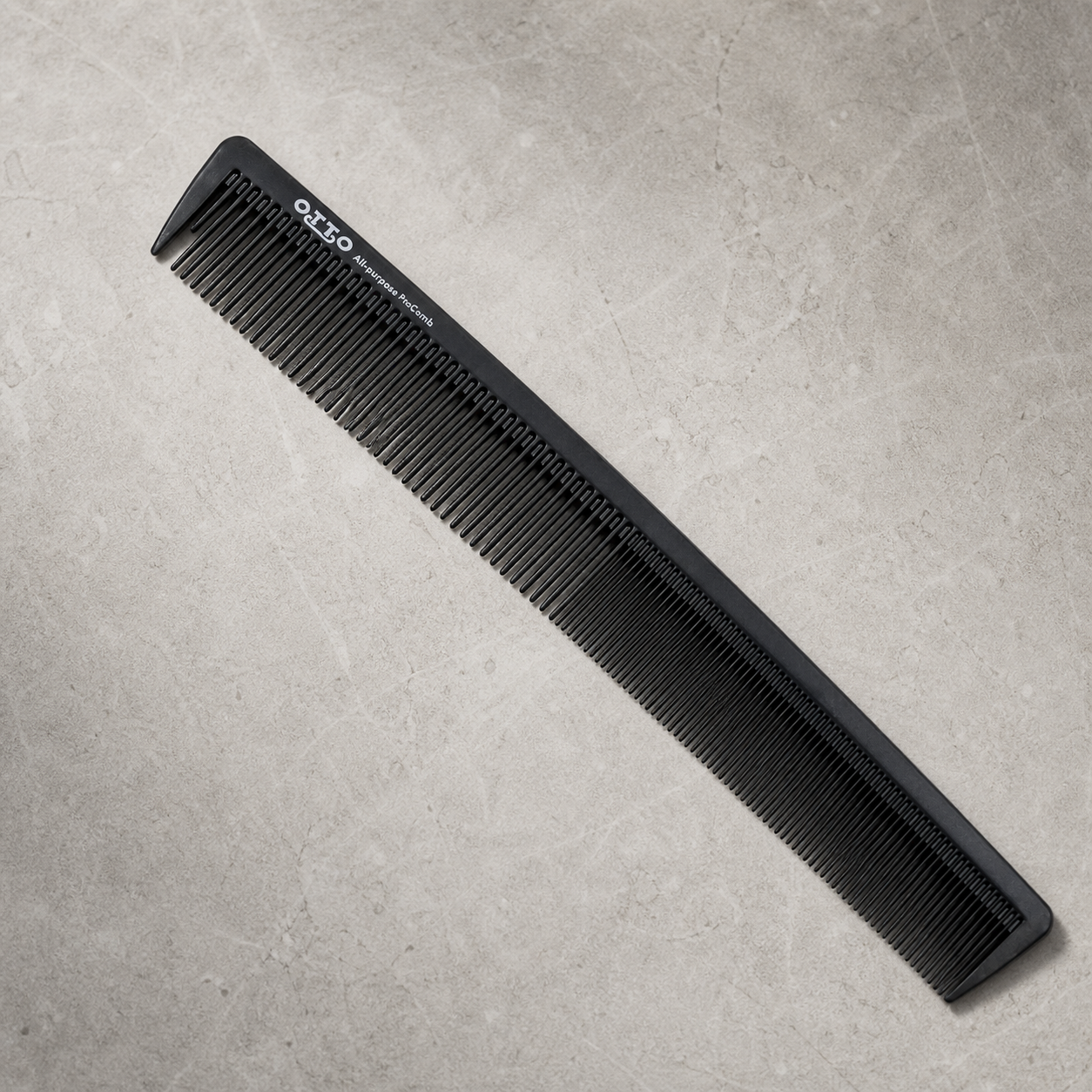 Otto 8.5-inch dual-tooth all-purpose comb on a light stone salon surface