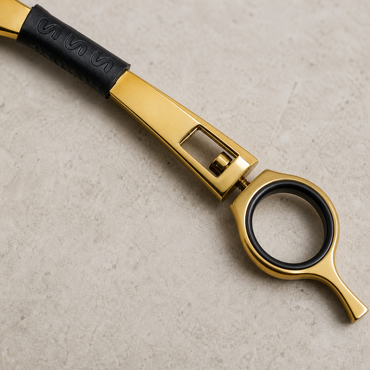 Detail of the Otto gold haircutting razor grip, hinge and finger ring