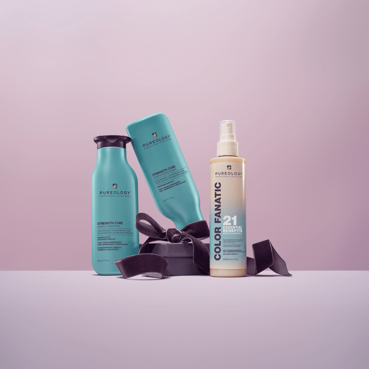 Strength Cure Holiday Trio - the three bottles in the set styled with a gift ribbon