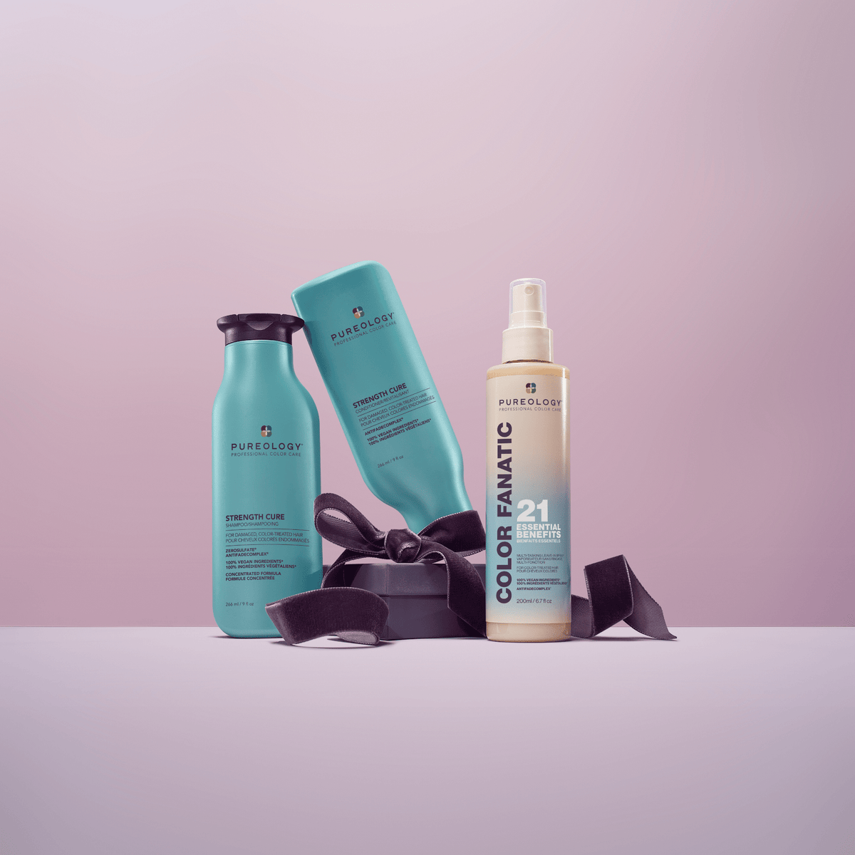 Strength Cure Holiday Trio - the three bottles in the set styled with a gift ribbon