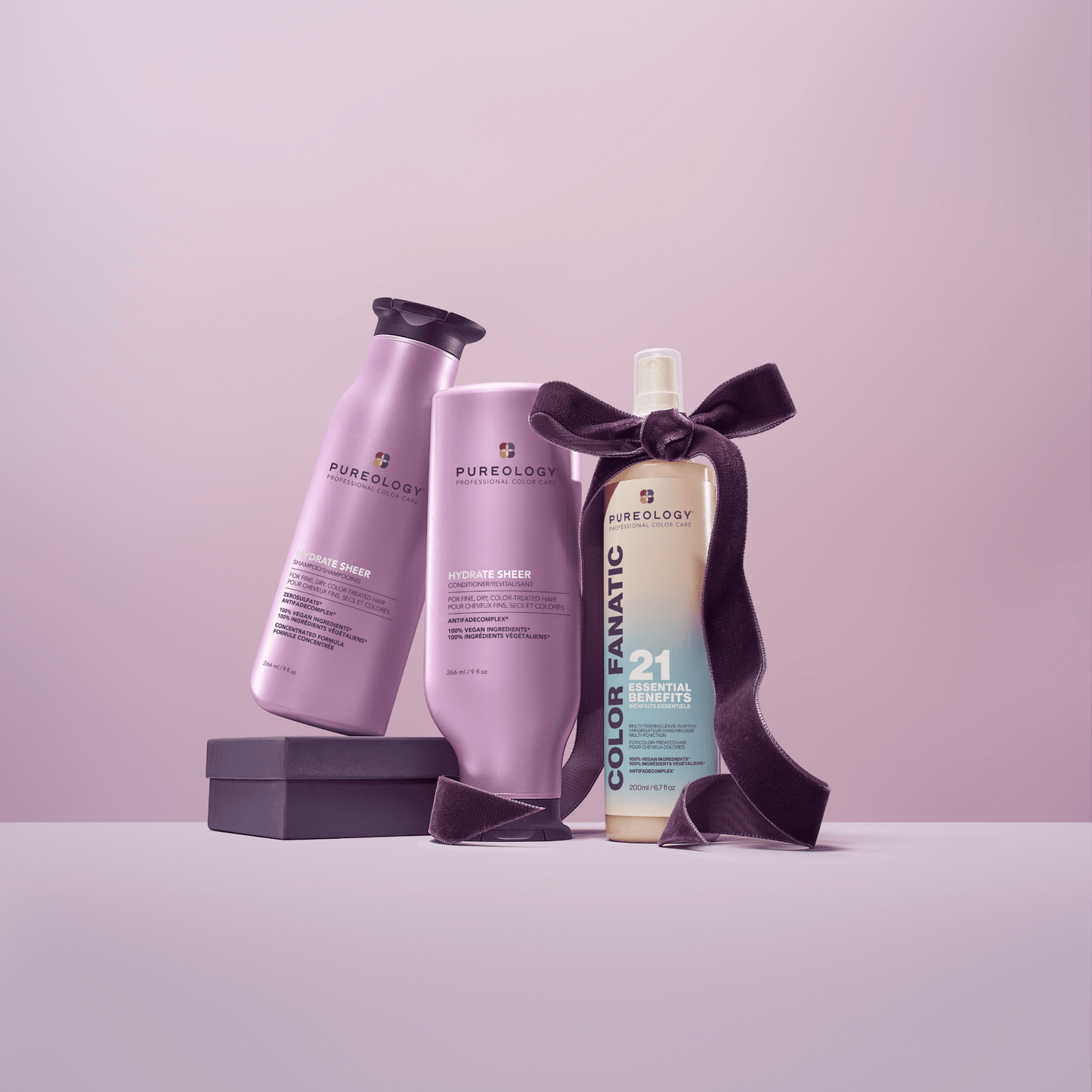 Hydrate Sheer Holiday Trio - the three bottles in the set styled with a gift ribbon