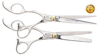 Olivia Garden SilkCut 6.5 inch left-handed shear with its matching thinner in the open case, on a plain white background