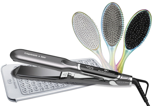 Olivia Garden Flat Iron — black and silver Titanium + Ion flat iron showing 455 on its display, resting on a silver dotted heat-resistant mat, with three iridescent oval Olivia Garden brushes fanned behind it, plain white background