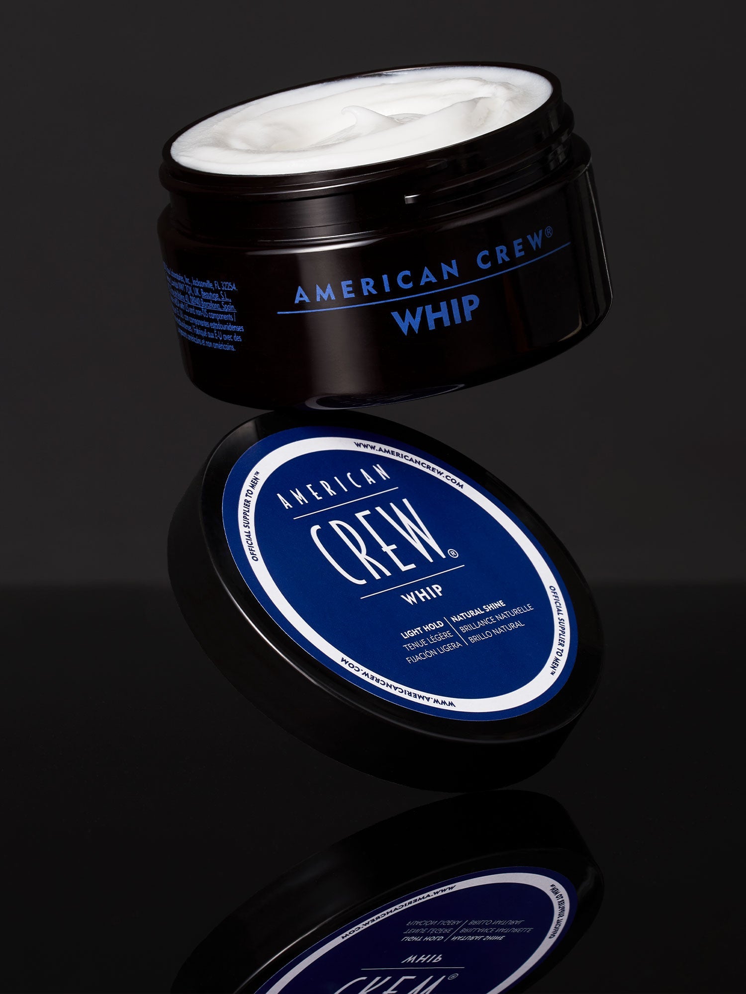 American Crew Whip Lightweight Styling Cream — open tub photographed on black, showing the white whipped formula